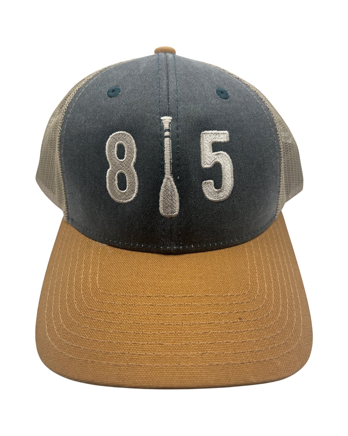 Blink Supply Co 815 Paddle Cap in navy, tan, and grey with embroidered 815 logo and paddle detail. Trucker style with mesh back.
