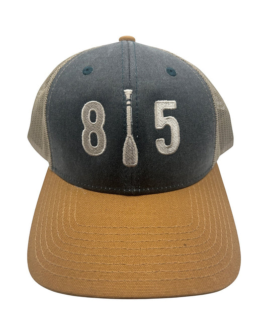 Blink Supply Co 815 Paddle Cap in navy, tan, and grey with embroidered 815 logo and paddle detail. Trucker style with mesh back.