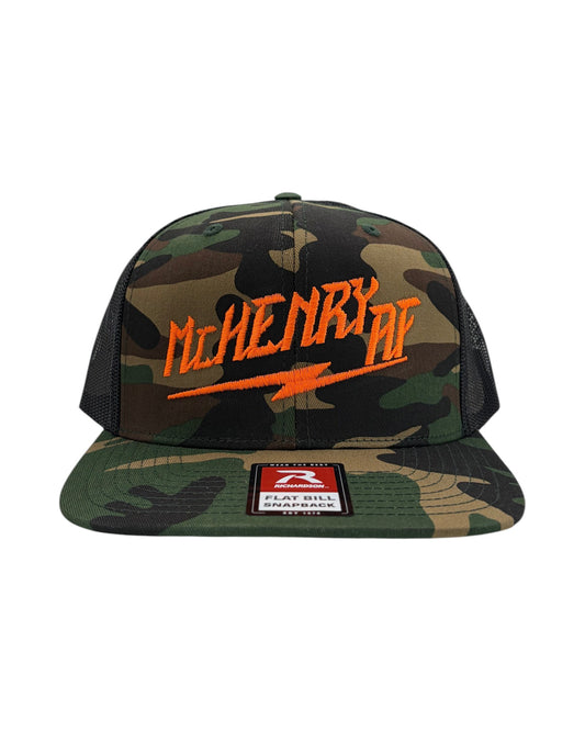 Blink Supply Co. McHenry AF trucker cap with camouflage pattern and orange embroidered text and lightning bolt.