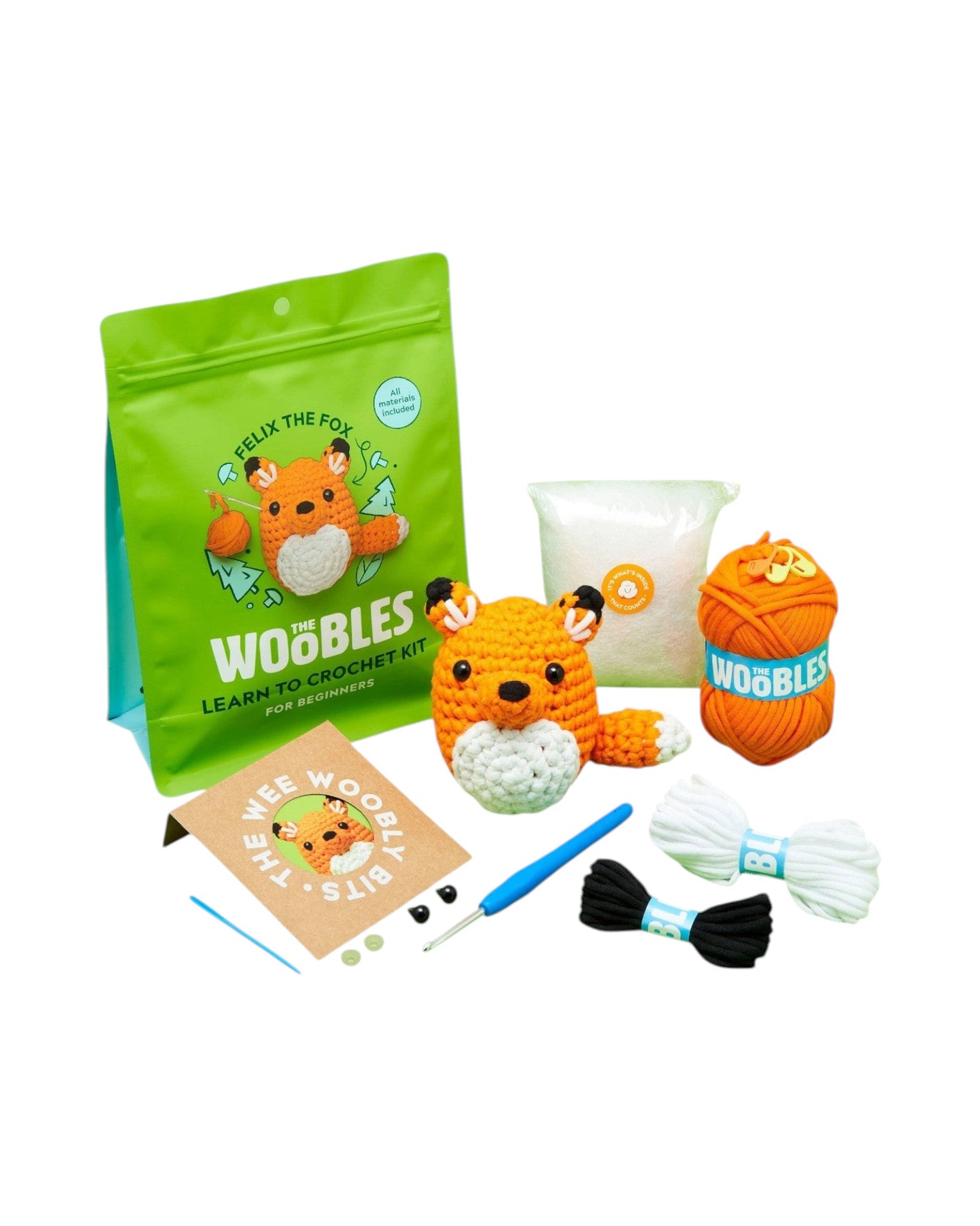 Blink Supply Co Felix the Fox crochet kit for beginners with orange yarn, stuffing, crochet hook, and accessories.