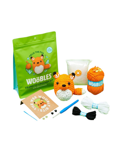 Blink Supply Co Felix the Fox crochet kit for beginners with orange yarn, stuffing, crochet hook, and accessories.