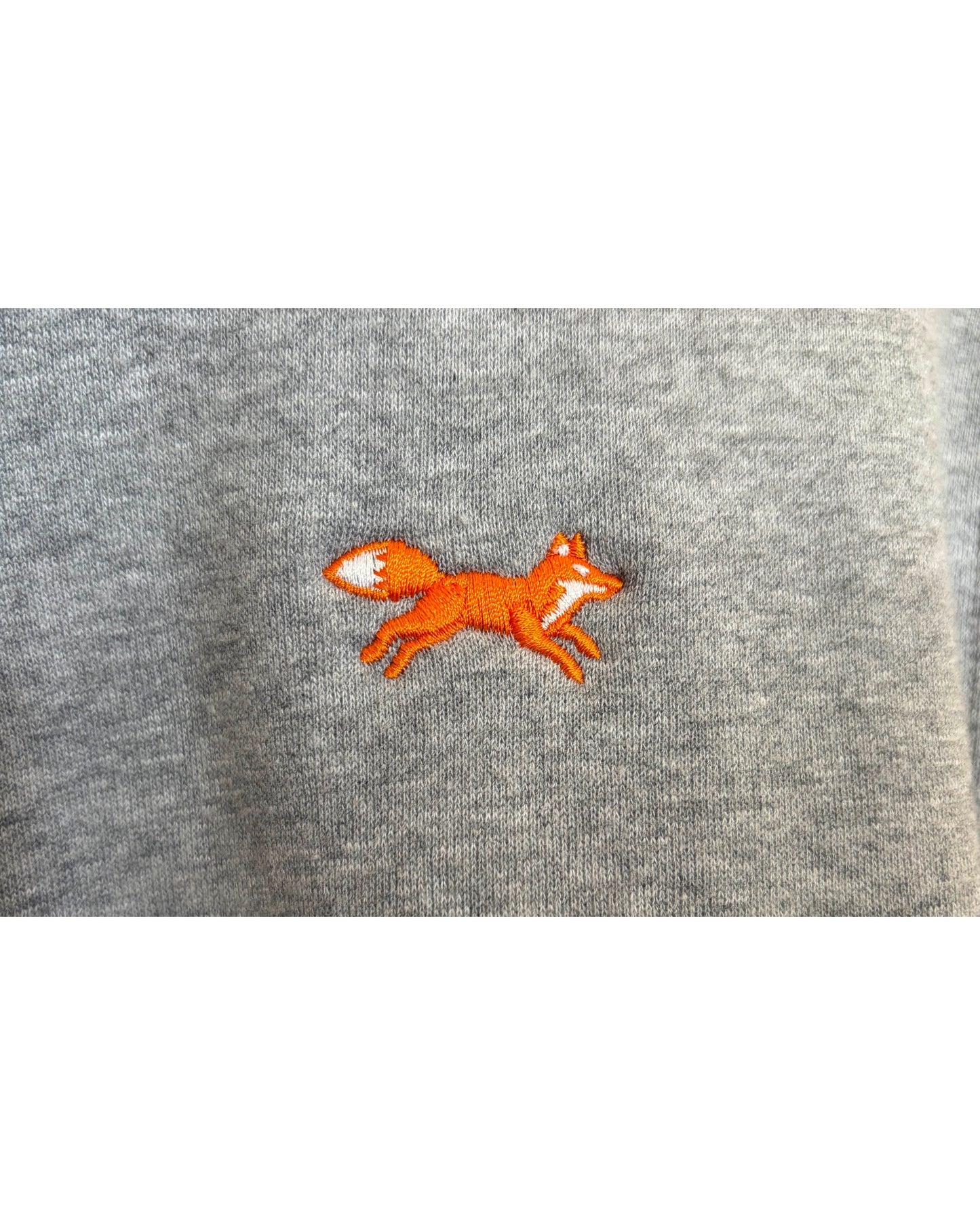 Blink Supply Co grey quarter zip sweatshirt with embroidered orange running fox detail.