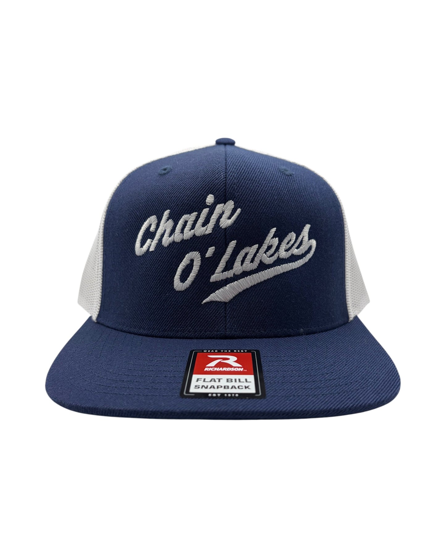 Blink Supply Co navy blue trucker cap with white mesh back and embroidered Chain O' Lakes logo. Flat bill design.