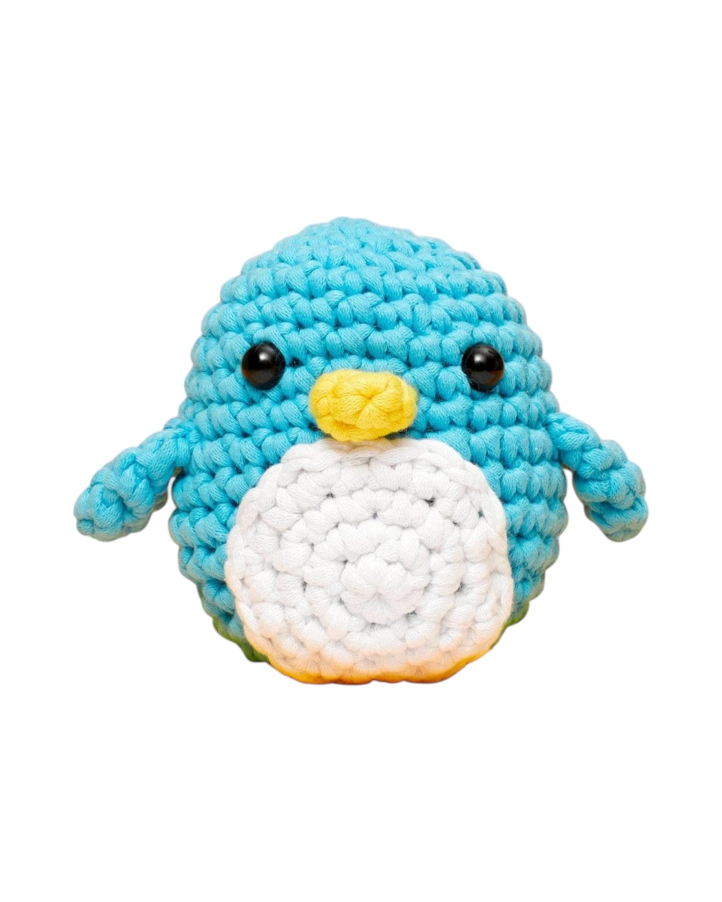 Blink Supply Co Pierre the Penguin beginner crochet kit. Blue, white, and yellow yarn with black safety eyes.