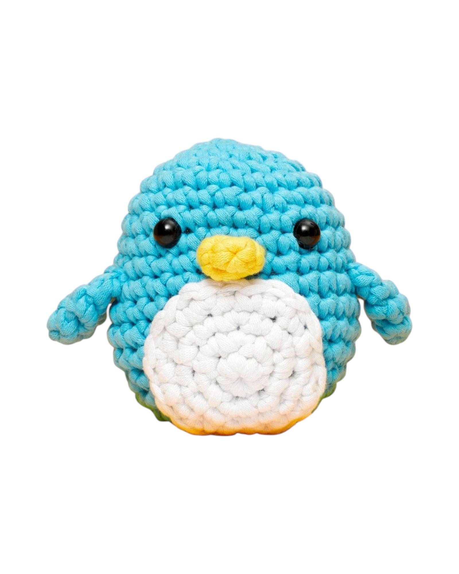 Blink Supply Co Pierre the Penguin beginner crochet kit. Blue, white, and yellow yarn with black safety eyes.