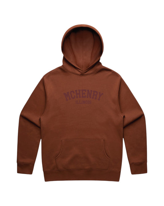 Blink Supply Co. clay brown cotton hoodie with embroidered "MCHENRY ILLINOIS" text on the chest. Relaxed fit, unisex, with a front kangaroo pocket.